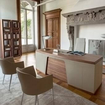 Distinguished Porada Flavio desk with canaletto walnut frame and plush hide leather accents in light beige and darker wood tones with satin finish