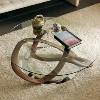 Exceptional Porada Infinity table with clear tempered glass and a sculpted solid Canaletta Walnut base in a natural wood finish