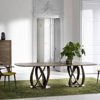 Distinctive Porada Infinity table with intertwined Canaletto walnut supports and chrome-plated metal base in satin finish