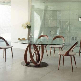 Distinctive Porada Infinity table with clear glass and dark brown Canaletto walnut, exhibiting a matte finish