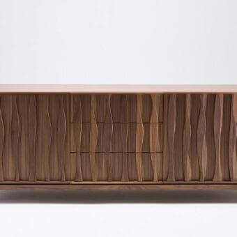 Elegant Porada Masai sideboard with carved canaletto walnut facade and brown matt metal base exhibiting balanced aesthetics