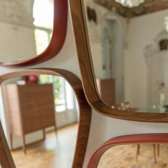 Superior Porada Mix mirror with interconnected clear mirror segments and smooth Canaletto walnut framing