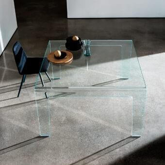 Distinguished Sovet Italia Frog table crafted in extralight bent glass with a seamless glossy finish and angular silhouette
