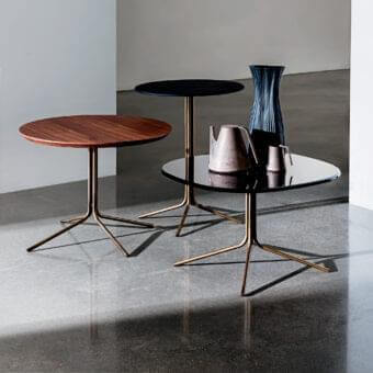 Superior Sovet Italia Genius coffee table with polished brass-toned metal base and clear glass tabletop crafted in an airy form