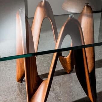 Distinguished Sovet Italia Lambda table with clear tempered glass and a smooth medium-brown Canaletto walnut wood base crafted in Italy