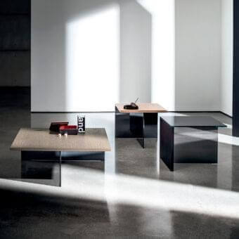 Sophisticated Sovet Italia Regolo coffee table with a satin light brown wood top and sharply angled dark metal base