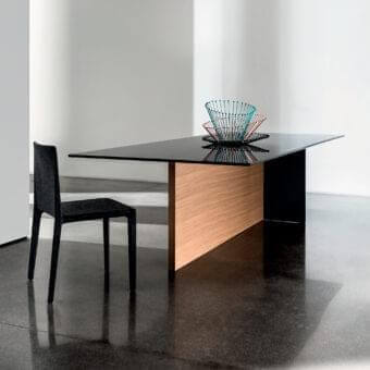 Superior Sovet Italia Regolo table with extra light clear glass and a warm-toned wood base built with black lacquered laminated glass