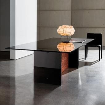 Distinguished Sovet Italia Regolo table with extra light clear laminated glass and black lacquered laminated glass base crafted in Italy