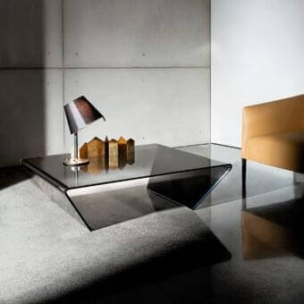 Superior Sovet Italia Rubino coffee table crafted in bent glass with a smoky gray glossy finish and geometric form