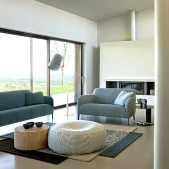 Superior Verzelloni Divanitas sofa with muted teal blue textile upholstery and burnished cast aluminum legs