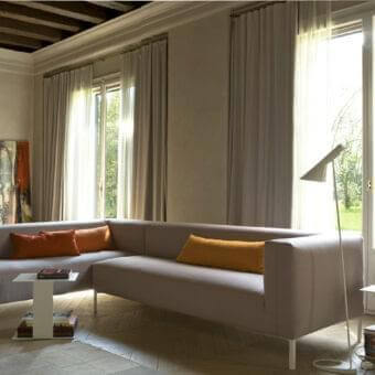 Distinguished Verzelloni Fold sectional with smooth matte gray textile upholstery and chrome metal legs