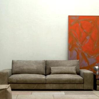 Elegant Verzelloni Holden sofa upholstered in brownish-gray textile with a matte finish and black-stained beech feet