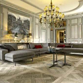 Sophisticated Verzelloni Irving sectional with medium gray woven textile upholstery and bronzed painted aluminum cast foot