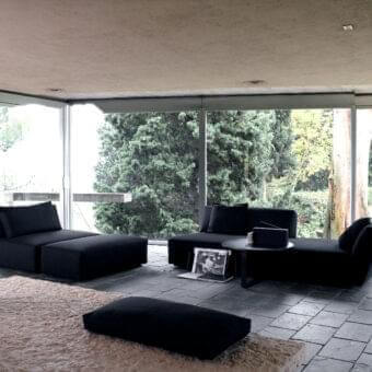 Distinguished Verzelloni Itaca sofa with matte black textile upholstery and solid wood framework supported by black-stained beech feet