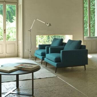 Exceptional Verzelloni Larsen lounge chair with deep teal textile upholstery and solid wood plywood frame