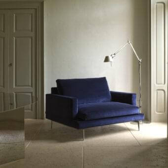 Exceptional Verzelloni Larsen lounge chair with deep blue textile upholstery and velvety matte finish