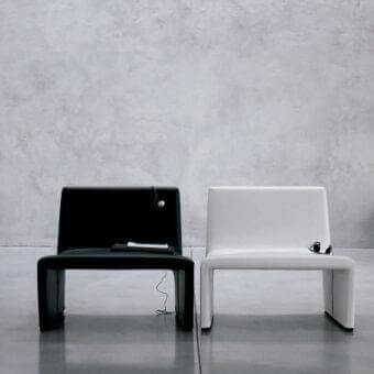 Superior Verzelloni Patty lounge chair in black polyurethane with metal insert and MDF feet