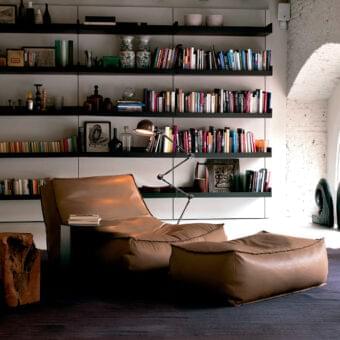 Lavish Verzelloni Zoe lounge chair with warm brown leather-like upholstery and visible seams finish