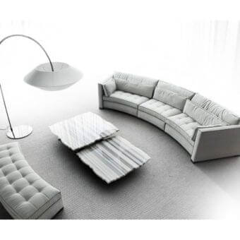 Lavish Erba Alchimia sectional with light gray textile upholstery, tufted seat cushions and dark contrasting trim