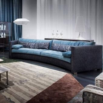 Exceptional Erba Alchimia sectional crafted in Italy with muted teal blue textile and charcoal gray accents
