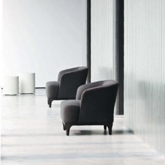 Elegant LaCividina Elle lounge chair with dark gray textile upholstery and black painted wood surround