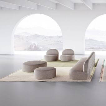 Distinguished LaCividina Guest Ottoman with rounded rectangular form and muted light taupe textured textile finish