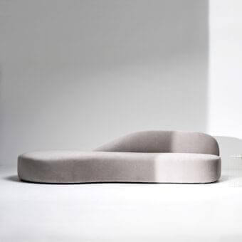 Distinguished LaCividina Guest sofa with organic form and muted gray textile upholstery exhibiting a matte finish