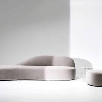 Superior LaCividina Guest sofa with a low profile and curved silhouette upholstered in light gray textile with a matte finish