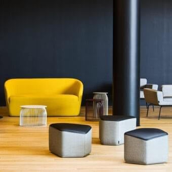 Distinguished LaCividina Modo ottoman with medium-gray textured fabric and dark smooth synthetic top surface