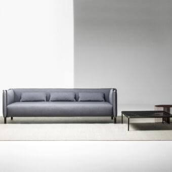 Superior LaCividina Pinch sofa with smooth matte medium gray textile and slender dark metal frame