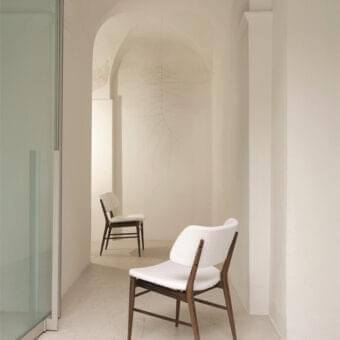 Superior Porada Nissa chair with solid Canaletto walnut frame and smooth white fabric upholstery