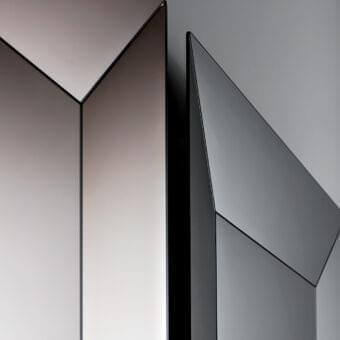 Superior Sovet Italia Denver mirror with angular beveled edges and dark trim reflecting subtle gray tones