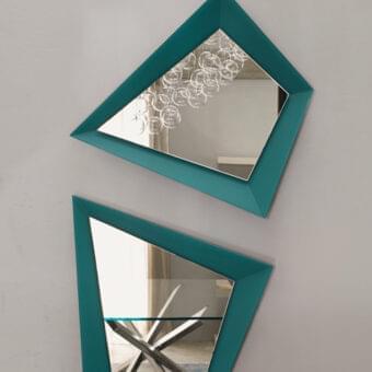 Distinguished Reflex Quartz mirror with an irregular pentagonal shape and teal lacquered glass frame surrounding extra clear mirrored glass