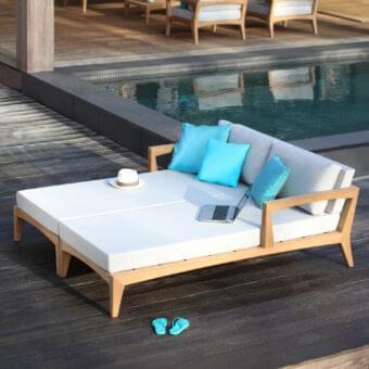 Distinguished Royal Botania Zenhit lounger with teak wood structure and comfortable cushions in light fabric with cyan blue accents