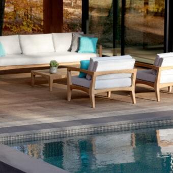 Distinguished Royal Botania Zenhit sofa with teak wood structure and light fabric seat cushions in neutral tones