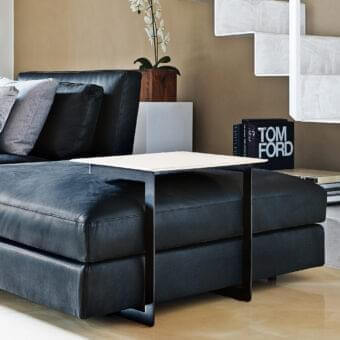 Distinguished Swan Italia Daiquiri side table with rectangular aluminum top and smooth beige hide upholstery