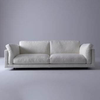 Distinguished Swan Italia host sofa with light textured fabric upholstery and powder-coated metal feet