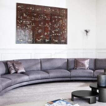 Superior Swan Italia Host sectional with curved silhouette and sumptuous gray textile upholstery built with powder-coated metal feet