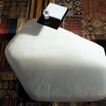 Superior Swan Italia Maki ottoman with organic form upholstered in completely removable Italian luxury white fabric and smooth finish