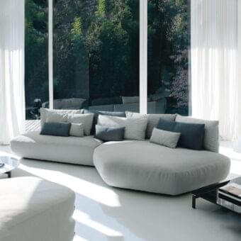 Distinguished Swan Italia Pack sectional with light gray velvet upholstery and included gray and blue feather-filled cushions