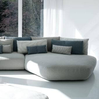 Superior Swan Italia Pack sectional with light gray fabric upholstery and plush feather cushions in coordinating tones