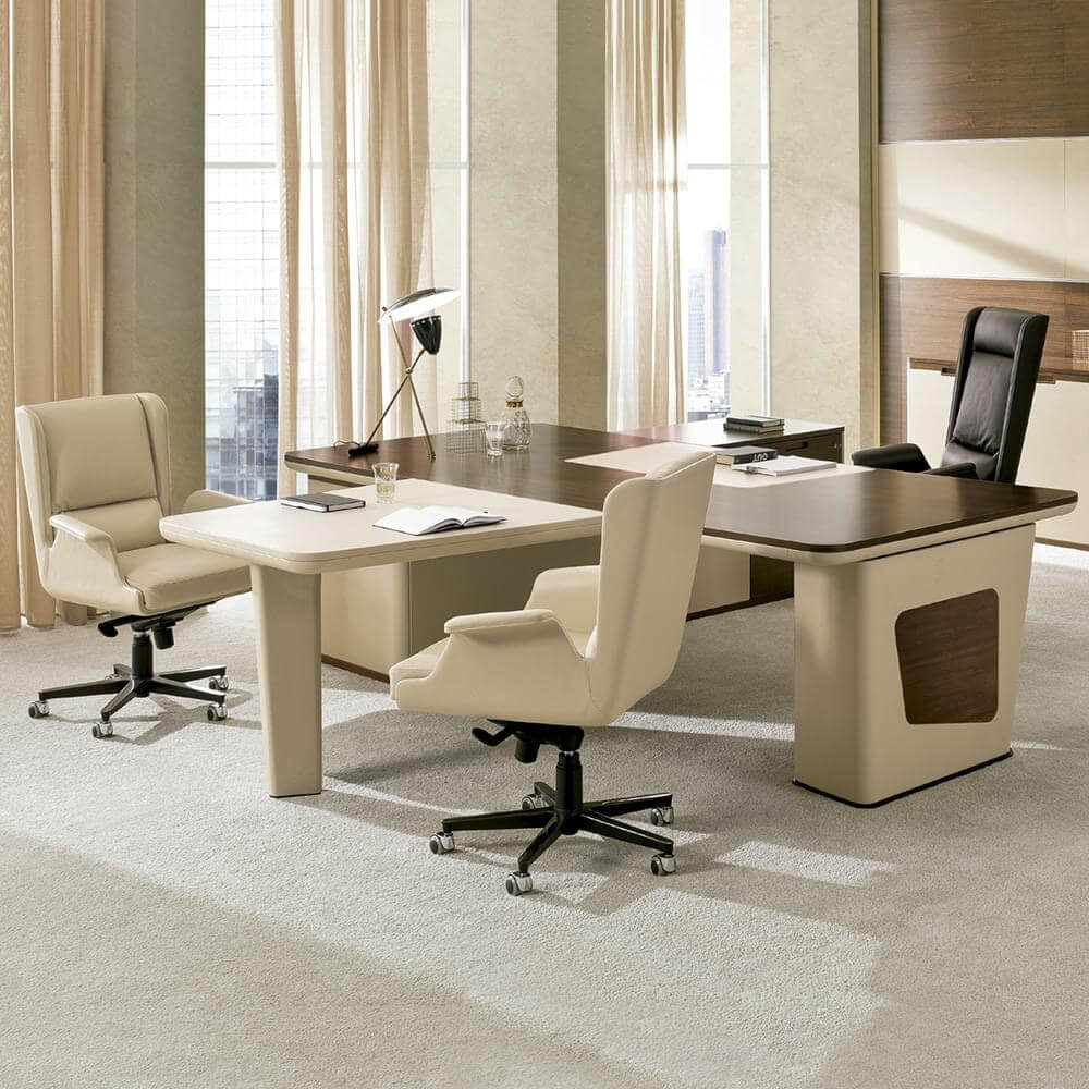 Executive desks with light beige wood veneer and cream tops, paired with ergonomic chairs, in a bright office with cityscape view.