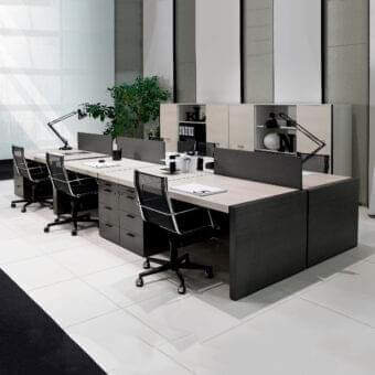 Distinguished 4 Mariani Blade desk with dark grey base supporting lighter wood, saddle leather detailing and three drawers