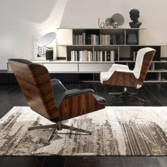Distinguished 4 Mariani Garbo lounge chair with organically curved black walnut shell and matte black textile upholstery, built with a silver swivel base