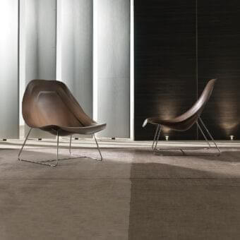 Distinguished 4 Mariani Oyster Light lounge chair with curved form crafted in saddle leather and chrome steel