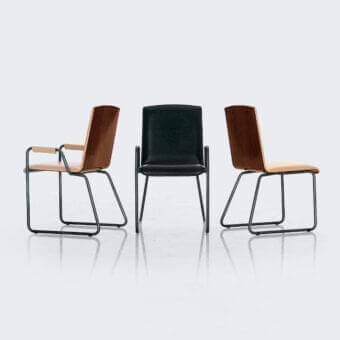Distinctive 4 Mariani Wing armchair with dark smooth textile upholstery and sleek black metal base