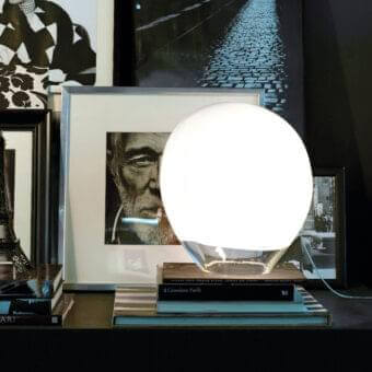 Elegant Vistosi Nessa table lamp with a rounded translucent glass globe and refined white band with glossy finish