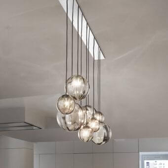 Elegant Vistosi Puppet suspension lamp crafted with hand-blown glass shades and glossy chrome metal components in subtle gray-brown tones