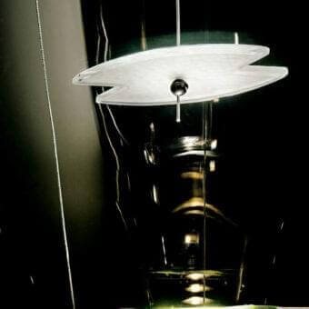 Distinguished Barovier&Toso Veronese table lamp with beveled crystal reflector and sleek wooden base casting a soft white and light green glow