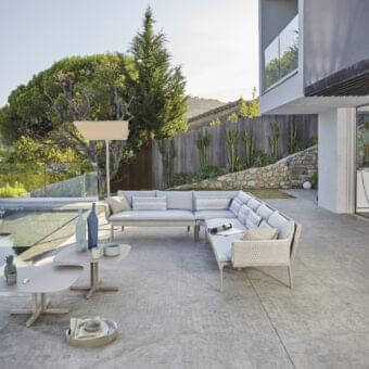 Superior Roberti Rattan Key West sectional with light grey cushions woven in Sunrope over Cipria powder-coated aluminum structure